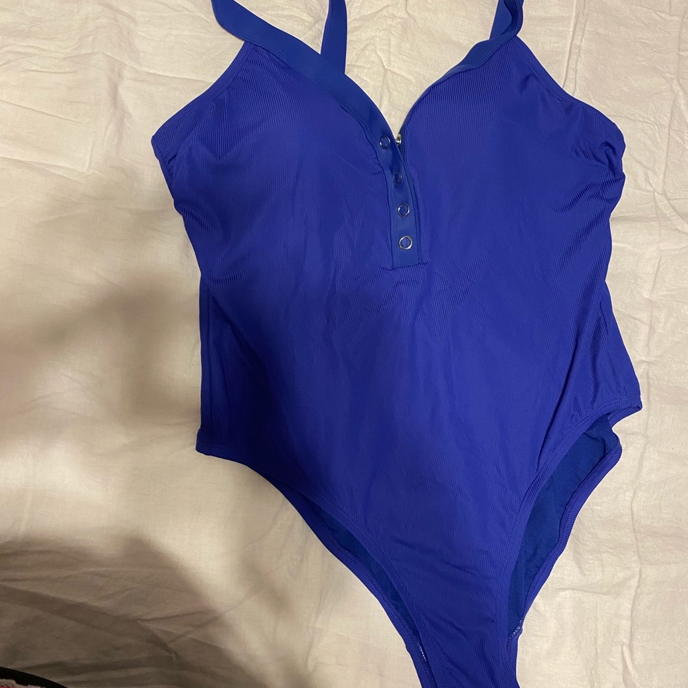 Blue bathing suit with snaps on the front